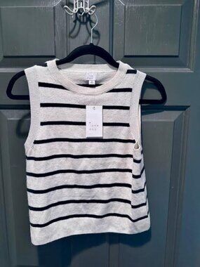 Sleeveless beige and black stripe sweater. Size medium.  NWT